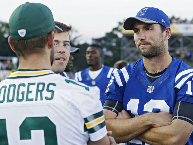 CANTON, OH - AUGUST 07: Andrew Luck #12 of the Indianapolis Colts talks with Aaron Rodgers #12 of the Green Bay Packers after the NFL Hall of Fame Game was canceled due to poor field conditions at Tom Benson Hall of Fame Stadium on August 7, 2016 in Canton, Ohio.