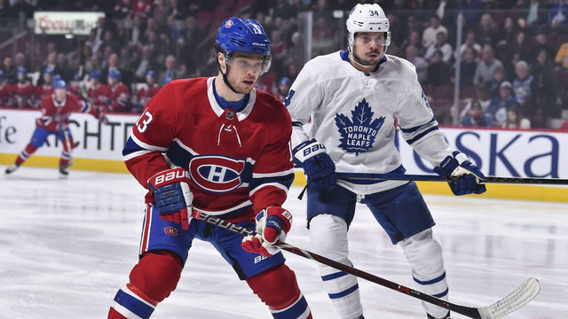 MONTREAL, QC - APRIL 06: Max Domi #13 of the Montreal Canadiens skates against Auston Matthews #34 of the Toronto Maple Leafs during the NHL game at the Bell Centre on April 6, 2019 in Montreal, Quebec, Canada. The Montreal Canadiens defeated the Toronto Maple Leafs 6-5 in a shootout.