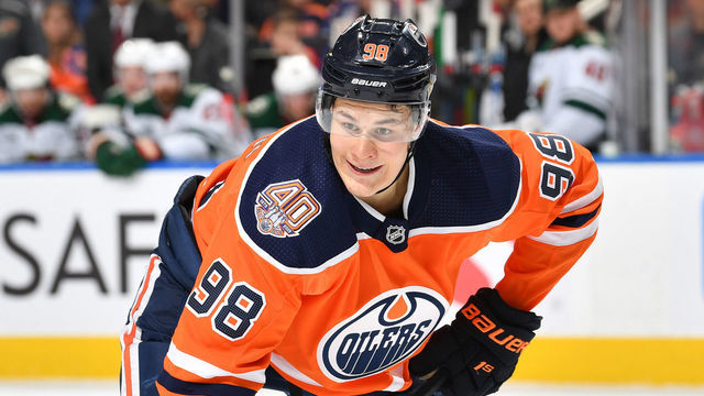 EDMONTON, AB - DECEMBER 7: Jesse Puljujarvi #98 of the Edmonton Oilers lines up for a face off during the game against the Minnesota Wild on December 7, 2018 at Rogers Place in Edmonton, Alberta, Canada.