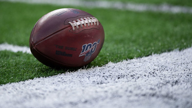 INDIANAPOLIS, IN - AUGUST 24: NFL football with the 100 year logo sits on the field during the week 3 NFL preseason game between the Chicago Bears and Indianapolis Colts on August 24, 2019 at Lucas Oil Stadium, in Indianapolis, IN.