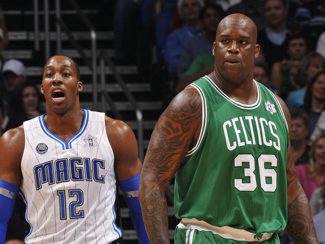 ORLANDO, FL - DECEMBER 25: Dwight Howard #12 of the Orlando Magic and Shaquille O'Neal #36 of the Boston Celtics walk up the court during the game on December 25, 2010 at the Amway Center in Orlando, Florida. Mandatory Copyright Notice: Copyright 2010 NBAE