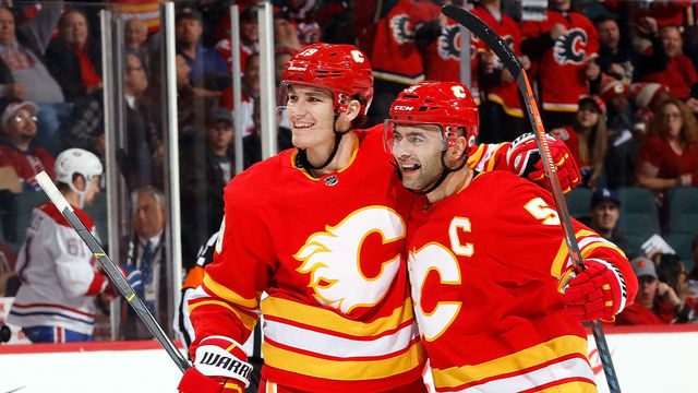 CALGARY, AB - NOVEMBER 15: Calgary Flames Left Wing Matthew Tkachuk #19 celebrates his goal against the Montreal Canadiens with Defenceman Mark Giordano #5 during an NHL game on November 15, 2018 at the Scotiabank Saddledome in Calgary, Alberta, Canada.