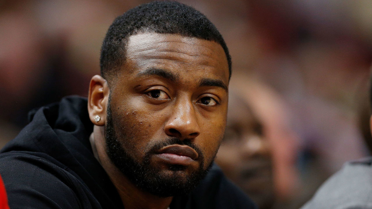 MIAMI, FL - JANUARY 04: John Wall #2 of the Washington Wizards looks on from the bench against the Miami Heat at American Airlines Arena on January 4, 2019 in Miami, Florida.