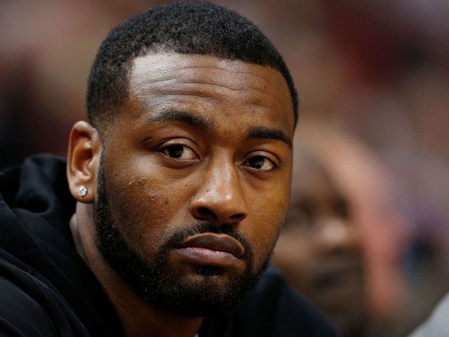 MIAMI, FL - JANUARY 04: John Wall #2 of the Washington Wizards looks on from the bench against the Miami Heat at American Airlines Arena on January 4, 2019 in Miami, Florida.