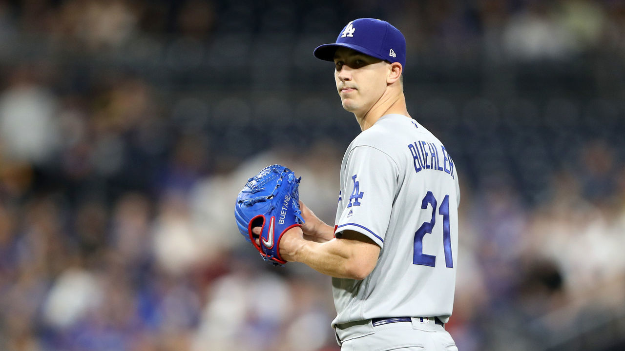 SAN DIEGO, CALIFORNIA - AUGUST 27: Walker Buehler #21 of the Los Angeles Dodgers looks on after hitting Manuel Margot #7 of the San Diego Padres with a pitch during the second inning of a game at PETCO Park on August 27, 2019 in San Diego, California.