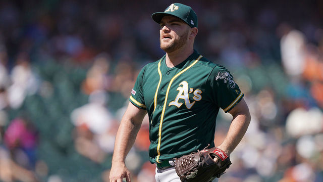 SAN FRANCISCO, CA - AUGUST 14: Liam Hendriks #16 of the Oakland Athletics walks back to the dugout after striking out Kevin Pillar #1 of the San Francisco Giants to end the eighth inning at Oracle Park on August 14, 2019 in San Francisco, California.