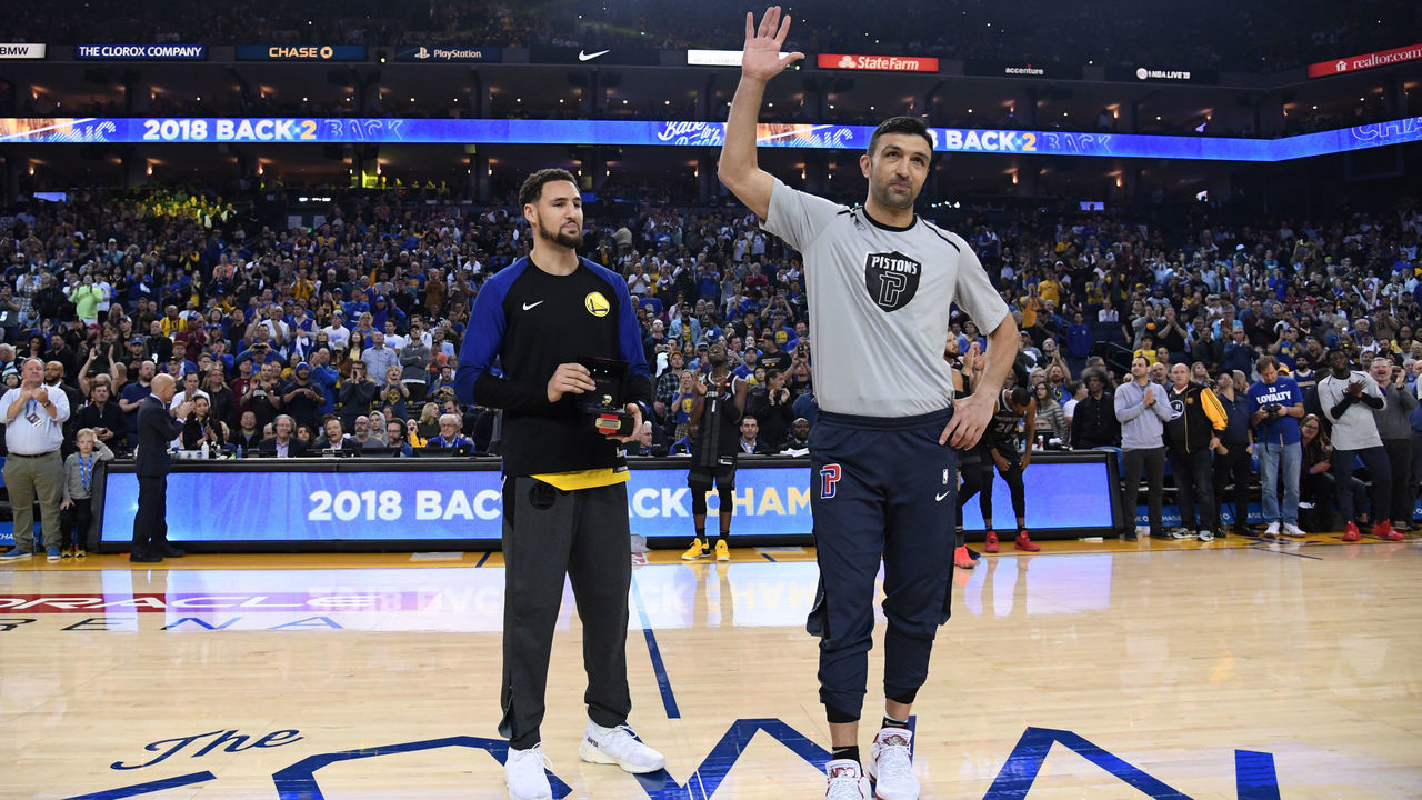 OAKLAND, CA - MARCH 24: Klay Thompson #11 of the Golden State Warriors present Zaza Pachulia #27 of the Detroit Pistons with his 2018 Championship ring prior to a game on March 24, 2019 at ORACLE Arena in Oakland, California. NOTE TO USER: User expressly acknowledges and agrees that, by downloading and or using this photograph, user is consenting to the terms and conditions of Getty Images License Agreement. Mandatory Copyright Notice: Copyright 2019 NBAE