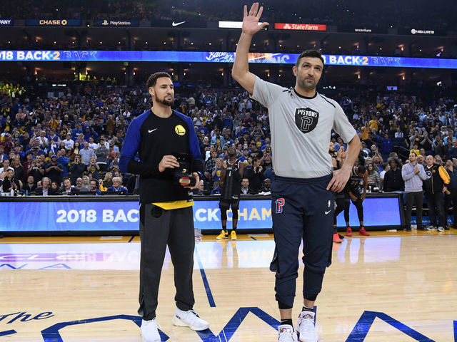 OAKLAND, CA - MARCH 24: Klay Thompson #11 of the Golden State Warriors present Zaza Pachulia #27 of the Detroit Pistons with his 2018 Championship ring prior to a game on March 24, 2019 at ORACLE Arena in Oakland, California. NOTE TO USER: User expressly acknowledges and agrees that, by downloading and or using this photograph, user is consenting to the terms and conditions of Getty Images License Agreement. Mandatory Copyright Notice: Copyright 2019 NBAE