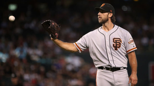 PHOENIX, ARIZONA - AUGUST 18: Starting pitcher Madison Bumgarner #40 of the San Francisco Giants catches a throw back during the third inning of the MLB game against the Arizona Diamondbacks at Chase Field on August 18, 2019 in Phoenix, Arizona.