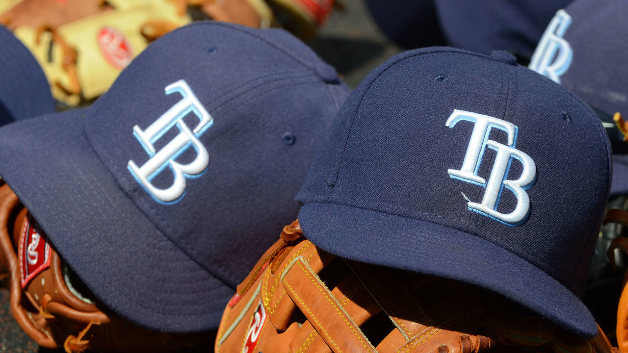 DETROIT, MI - APRIL 11: A detailed view of a group of Tampa Bay Rays baseball hats and gloves sitting in the dugout during the game against the Detroit Tigers at Comerica Park on April 11, 2012 in Detroit, Michigan. The Rays defeated the Tigers 4-2.