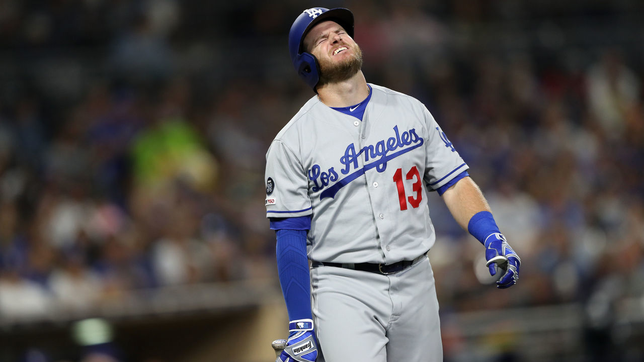 SAN DIEGO, CALIFORNIA - AUGUST 28: Max Muncy #13 of the Los Angeles Dodgers reacts after being hit by a pitch during the fifth inning of a game against the San Diego Padres at PETCO Park on August 28, 2019 in San Diego, California. Muncy left the game after being examined by trainers.