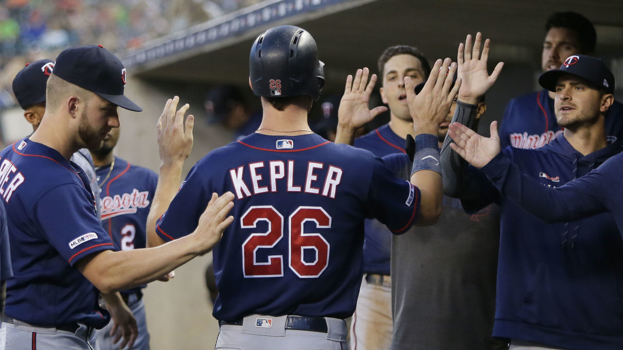 DETROIT, MI - AUGUST 30: Max Kepler #26 of the Minnesota Twins celebrates in the dugout after scoring against the Detroit Tigers on a sacrifice fly ball hit by Miguel Sano #22 during the second inning at Comerica Park on August 30, 2019 in Detroit, Michigan.