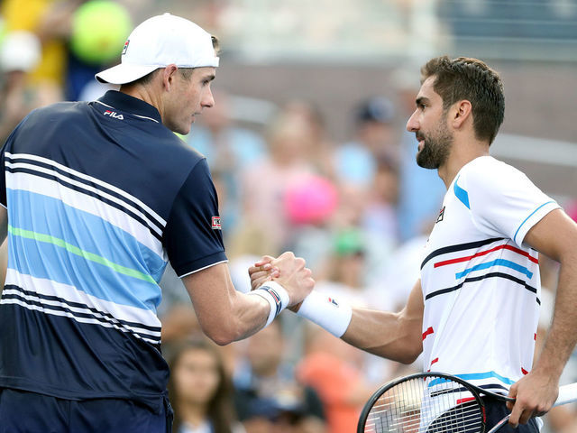 NEW YORK, NEW YORK - AUGUST 31: John Isner of the United States and Marin Cilic of Croatia shake hands following their Men's Singles third round match on day six of the 2019 US Open at the USTA Billie Jean King National Tennis Center on August 31, 2019 in Queens borough of New York City.