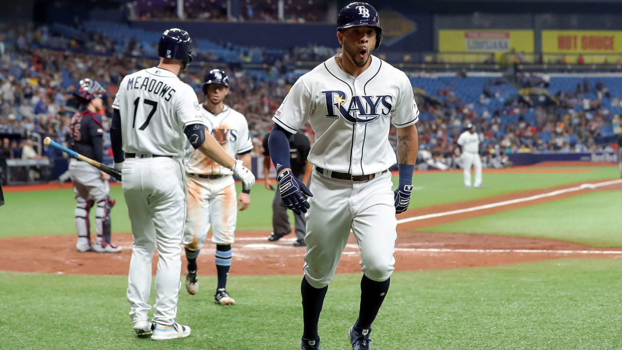 ST. PETERSBURG, FL - AUGUST 31: Tommy Pham #29 of the Tampa Bay Rays (R) celebrates hitting a two-run home run in the third inning of a baseball game against the Cleveland Indians at Tropicana Field on August 31, 2019 in St. Petersburg, Florida.