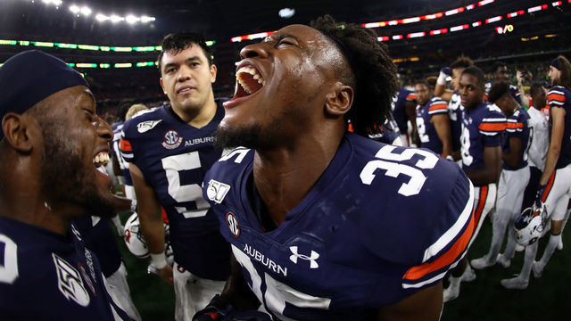 ARLINGTON, TEXAS - AUGUST 31: Zakoby McClain #35 of the Auburn Tigers celebrates a 27-21 win against the Oregon Ducks during the Advocare Classic at AT&T Stadium on August 31, 2019 in Arlington, Texas.