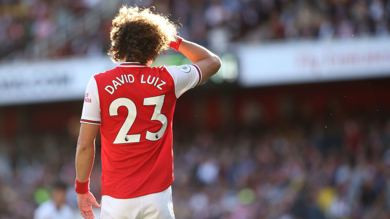 LONDON, ENGLAND - SEPTEMBER 01: David Luiz of Arsenal shields his eyes from the low sunlight during the Premier League match between Arsenal FC and Tottenham Hotspur at Emirates Stadium on September 1, 2019 in London, United Kingdom.