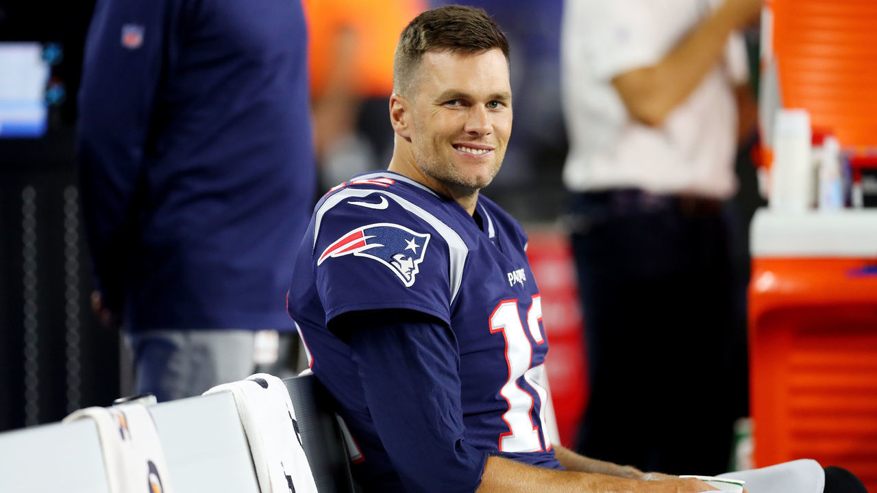 FOXBOROUGH, MASSACHUSETTS - AUGUST 29: Tom Brady #12 of the New England Patriots looks on from the bench during the preseason game between the New York Giants and the New England Patriots at Gillette Stadium on August 29, 2019 in Foxborough, Massachusetts.