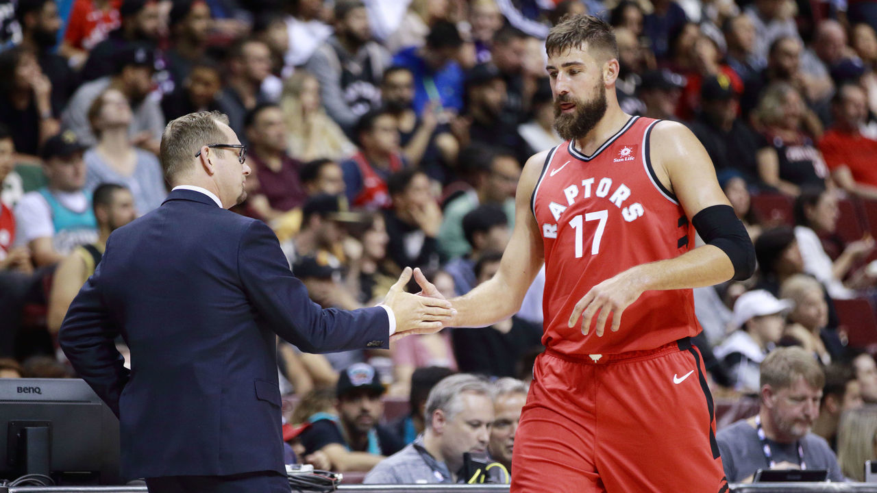 VANCOUVER, BC - SEPTEMBER 29: Head Coach Nick Nurse and Jonas Valanciunas #17 of the Toronto Raptors high five during the game against the Portland Trail Blazers during a preseason game on September 29, 2018 at Rogers Arena in Vancouver, British Columbia, Canada. NOTE TO USER: User expressly acknowledges and agrees that, by downloading and or using this photograph, user is consenting to the terms and conditions of Getty Images License Agreement. Mandatory Copyright Notice: Copyright 2018 NBAE