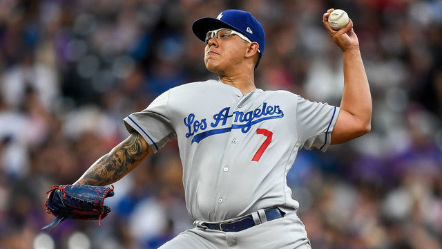 DENVER, CO - JULY 30: Los Angeles Dodgers starting pitcher Julio Urias (7) pitches against the Colorado Rockies during a regular season Major League Baseball game on July 30, 2019 at Coors Field in Denver, Colorado.