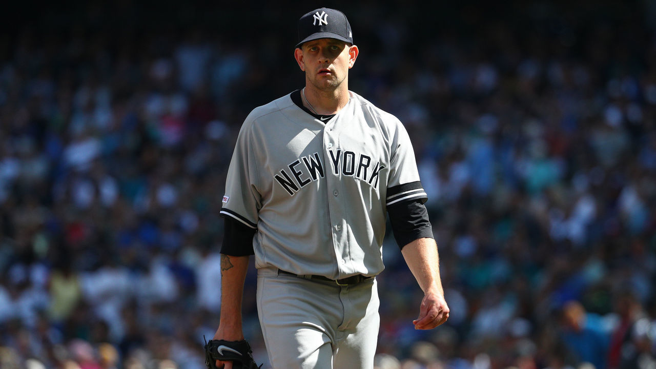 SEATTLE, WASHINGTON - AUGUST 28: James Paxton #65 of the New York Yankees reacts while walking back to the dugout after giving up a two run home run against Kyle Seager #15 of the Seattle Mariners in the fourth inning during their game at T-Mobile Park on August 28, 2019 in Seattle, Washington.
