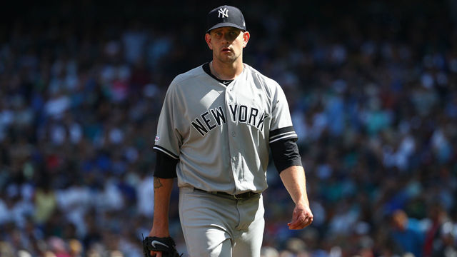 SEATTLE, WASHINGTON - AUGUST 28: James Paxton #65 of the New York Yankees reacts while walking back to the dugout after giving up a two run home run against Kyle Seager #15 of the Seattle Mariners in the fourth inning during their game at T-Mobile Park on August 28, 2019 in Seattle, Washington.