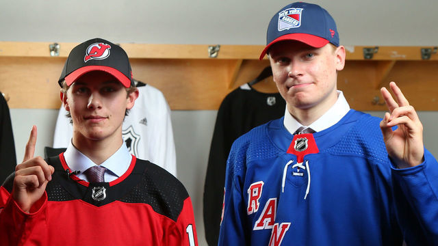VANCOUVER, BRITISH COLUMBIA - JUNE 21: (L-R) Kirby Dach, third overall pick by the Chicago Blackhawks, Jack Hughes, first overall pick by the New Jersey Devils, and Kaapo Kakko, second overall pick by the New York Rangers, pose for group photo during the first round of the 2019 NHL Draft at Rogers Arena on June 21, 2019 in Vancouver, Canada.
