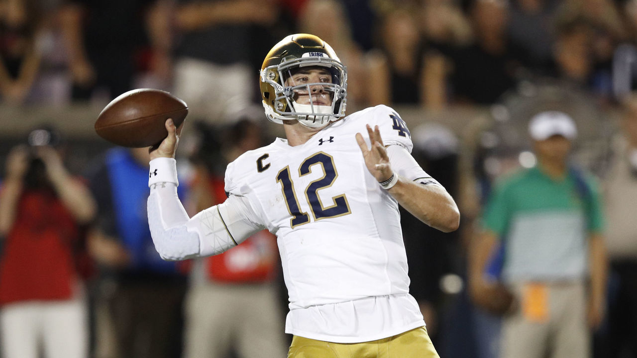 LOUISVILLE, KY - SEPTEMBER 02: Ian Book #12 of the Notre Dame Fighting Irish throws a pass against the Louisville Cardinals during a game at Cardinal Stadium on September 2, 2019 in Louisville, Kentucky. Notre Dame defeated Louisville 35-17.