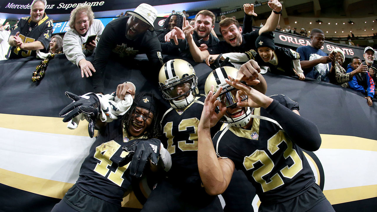 NEW ORLEANS, LA - DECEMBER 24: Alvin Kamara #41 of the New Orleans Saints, Marshon Lattimore #23 and Michael Thomas #13 celebrate after a game against the Atlanta Falcons at the Mercedes-Benz Superdome on December 24, 2017 in New Orleans, Louisiana.