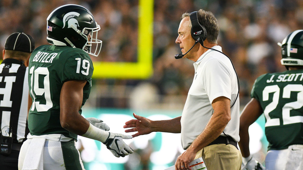 EAST LANSING, MI - AUGUST 30: Michigan State head coach Mark Dantonio greets cornerback Josh Butler (19) after Butler forces a defensive safety during a college football game between the Michigan State Spartans and Tulsa Golden Hurricane on August 30, 2019 at Spartan Stadium in East Lansing, MI.