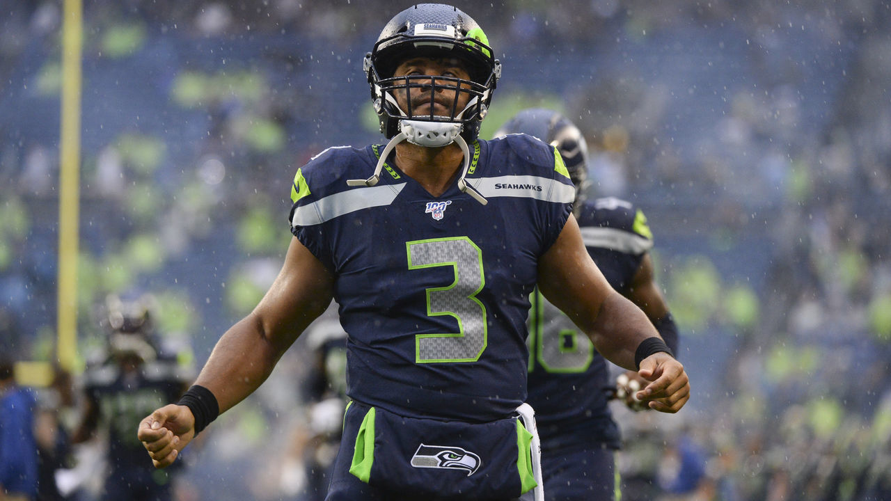 SEATTLE, WA - AUGUST 29: Seattle Seahawks quarterback Russell Wilson (3) says a prayer in the end zone before a preseason game between the Oakland Raiders and the Seattle Seahawks on August 29 at Century Link Stadium in Seattle, WA.