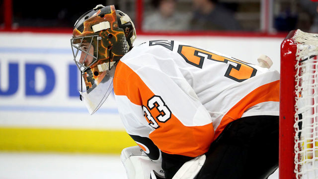 RALEIGH, NC - MARCH 30: Cam Talbot #33 of the Philadelphia Flyers crouches in the crease to protect the net during an NHL game against the Carolina Hurricanes on March 30, 2019 at PNC Arena in Raleigh, North Carolina.