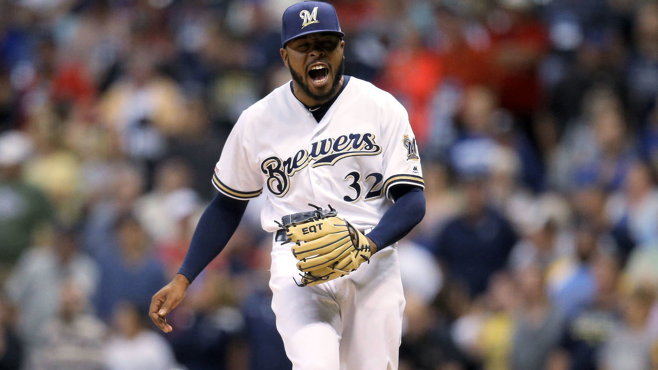 MILWAUKEE, WISCONSIN - JULY 22: Jeremy Jeffress #32 of the Milwaukee Brewers reacts after giving up a home run in the ninth inning against the Cincinnati Reds at Miller Park on July 22, 2019 in Milwaukee, Wisconsin.