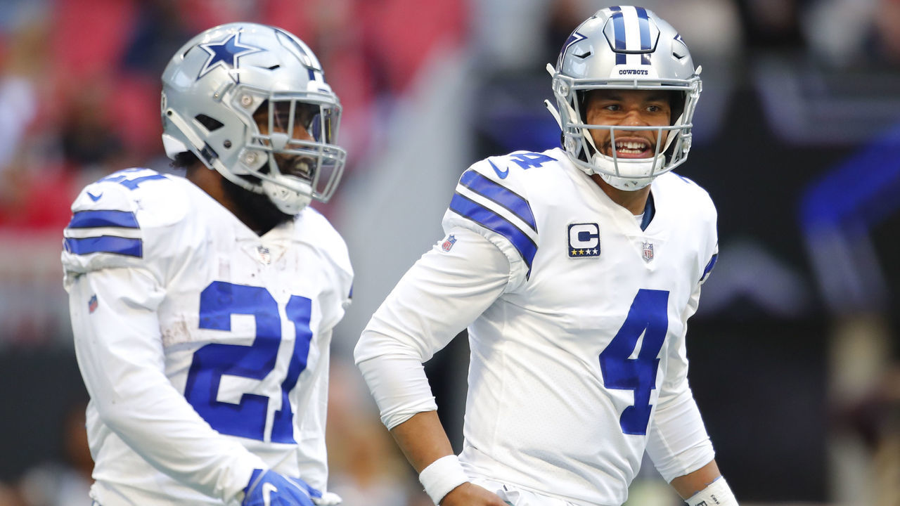 ATLANTA, GA - NOVEMBER 18: Dallas Cowboys quarterback Dak Prescott (4) speaks with running back Ezekiel Elliott (21) in an NFL football game between the Dallas Cowboys and Atlanta Falcons on November 18, 2018 at Mercedes-Benz Stadium in Atlanta, GA.