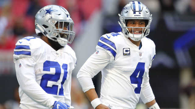 ATLANTA, GA - NOVEMBER 18: Dallas Cowboys quarterback Dak Prescott (4) speaks with running back Ezekiel Elliott (21) in an NFL football game between the Dallas Cowboys and Atlanta Falcons on November 18, 2018 at Mercedes-Benz Stadium in Atlanta, GA.
