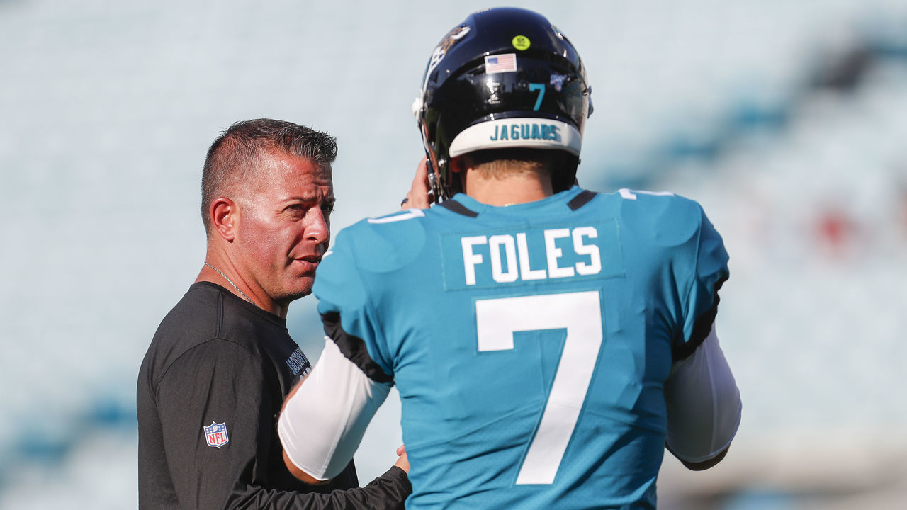 JACKSONVILLE, FLORIDA - AUGUST 29: Nick Foles #7 of the Jacksonville Jaguars talks with Offensive Coordinator John DeFilippo before a preseason game against the Atlanta Falcons at TIAA Bank Field on August 29, 2019 in Jacksonville, Florida.