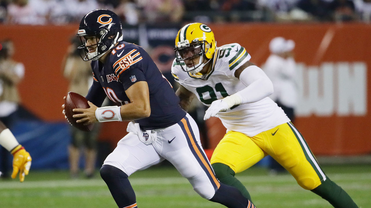 CHICAGO, ILLINOIS - SEPTEMBER 05: Mitchell Trubisky #10 of the Chicago Bears runs with the ball as he is pursued by Preston Smith #91 of the Green Bay Packers during the first quarter in the game at Soldier Field on September 05, 2019 in Chicago, Illinois.