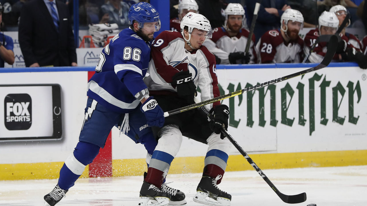 TAMPA, FL - DECEMBER 08: Tampa Bay Lightning right wing Nikita Kucherov (86) and Colorado Avalanche defenseman Samuel Girard (49) battle for the puck in the second period of the NHL game between the Colorado Avalanche and Tampa Bay Lightning on December 08, 2018 at Amalie Arena in Tampa,FL.