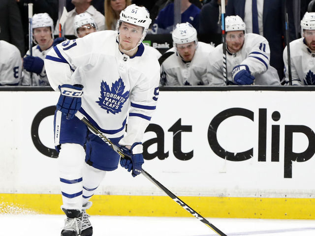 BOSTON, MA - APRIL 19: Toronto Maple Leafs defenseman Jake Gardiner (51) looks for the cross ice pass during Game 5 of the First Round Stanley Cup Playoffs between the Boston Bruins and the Toronto Maple Leafs on April 19, 2019, at TD garden in Boston, Massachusetts.