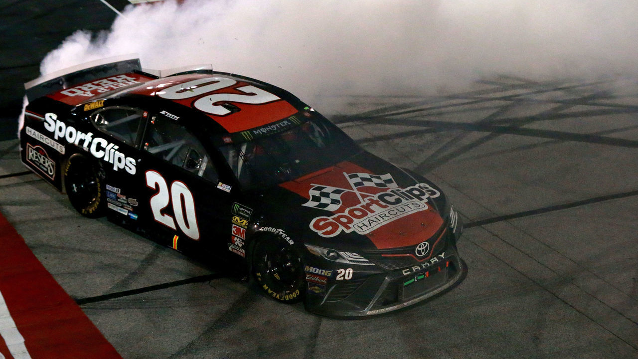 DARLINGTON, SOUTH CAROLINA - SEPTEMBER 02: Erik Jones, driver of the #20 Sport Clips Throwback Toyota, celebrates with a burnout after winning the Monster Energy NASCAR Cup Series Bojangles' Southern 500 at Darlington Raceway on September 02, 2019 in Darlington, South Carolina.