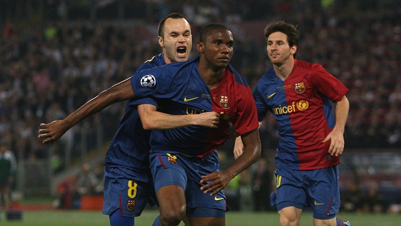 Barcelona's Samuel Eto'o (centre) celebrates with team mate Andres Iniesta after scoring his sides first goal of the game.
