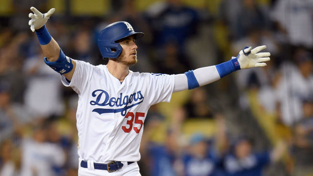LOS ANGELES, CALIFORNIA - JULY 03: Cody Bellinger #35 of the Los Angeles Dodgers reacts to his walk-off solo homerun in front of Carson Kelly #18 of the Arizona Diamondbacks, for a 5-4 win, during the tenth inning at Dodger Stadium on July 03, 2019 in Los Angeles, California.