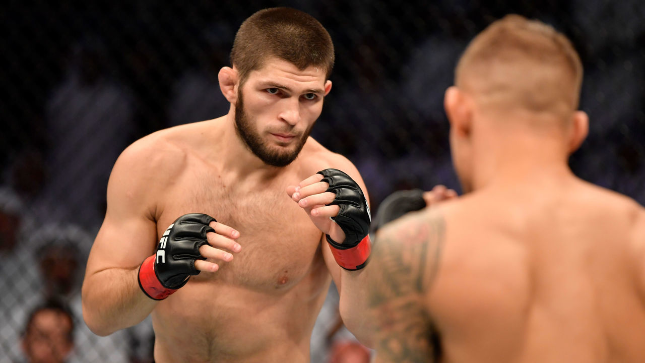 ABU DHABI, UNITED ARAB EMIRATES - SEPTEMBER 07: (L-R) Khabib Nurmagomedov of Russia battles Dustin Poirier in their lightweight championship bout during UFC 242 at The Arena on September 7, 2019 in Yas Island, Abu Dhabi, United Arab Emirates.