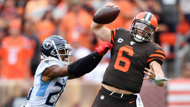 CLEVELAND, OH - SEPTEMBER 08: Quarterback Baker Mayfield #6 of the Cleveland Browns is harassed by Logan Ryan #26 of the Tennessee Titans in the second quarter at FirstEnergy Stadium on September 08, 2019 in Cleveland, Ohio .