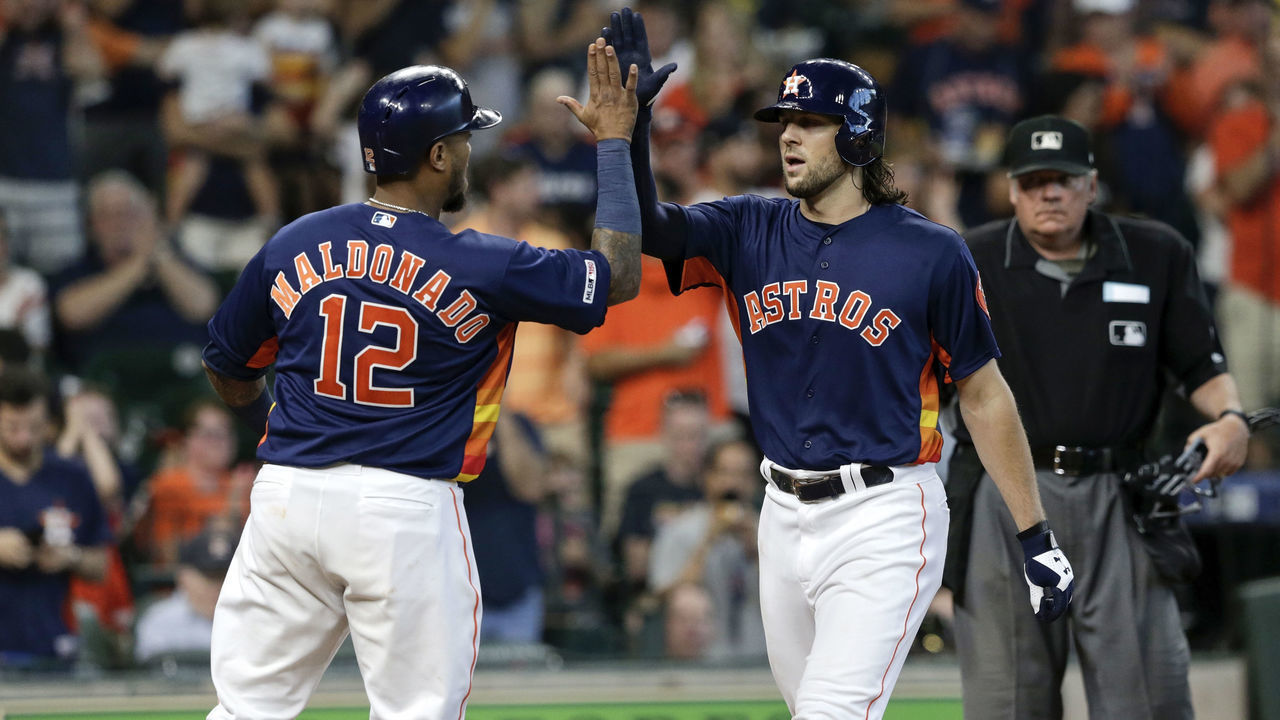 HOUSTON, TX - SEPTEMBER 08: Martin Maldonado #12 of the Houston Astros congratulates Jake Marisnick #6 after a two run home run in the second inning against the Seattle Mariners at Minute Maid Park on September 8, 2019 in Houston, Texas.