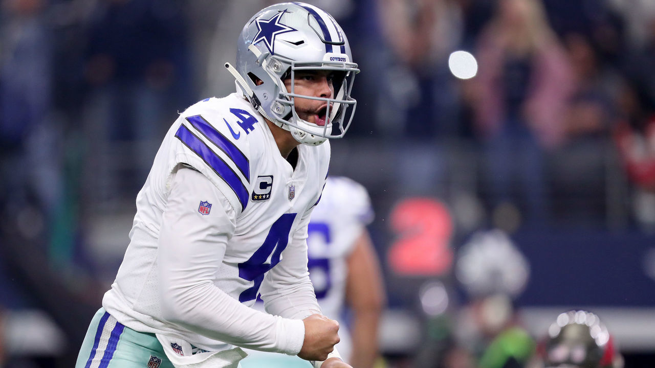 ARLINGTON, TEXAS - DECEMBER 23: Dak Prescott #4 of the Dallas Cowboys celebrates after the Dallas Cowboys score against the Tampa Bay Buccaneers in the fourth quarter at AT&T Stadium on December 23, 2018 in Arlington, Texas.