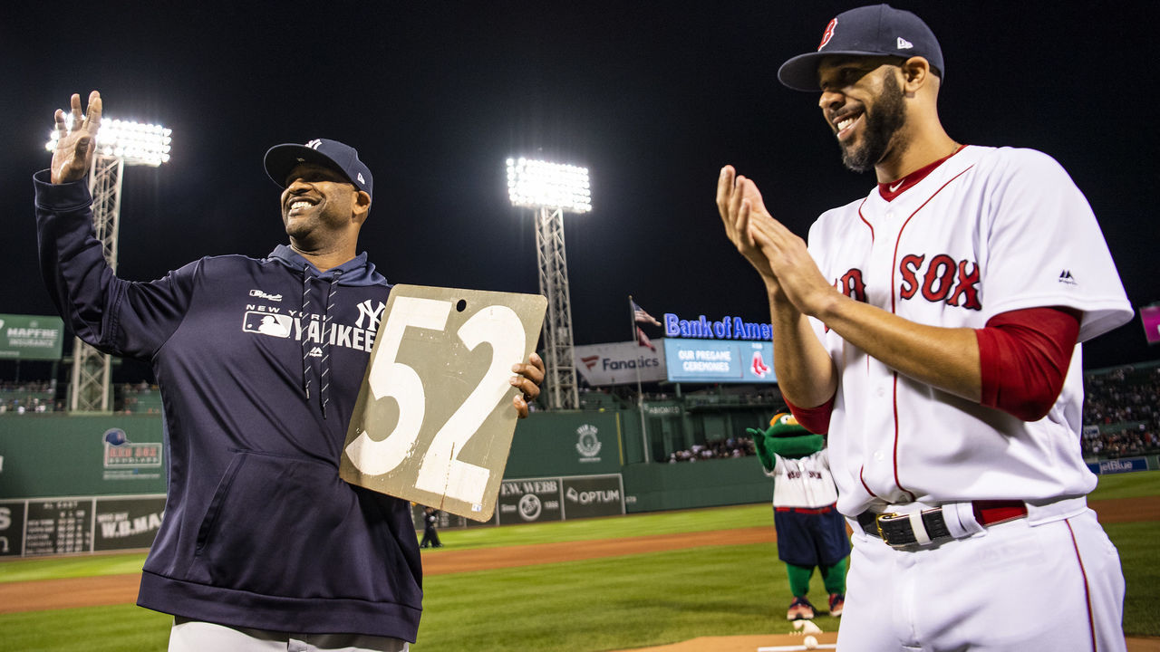 BOSTON, MA - SEPTEMBER 8: CC Sabathia #52 of the New York Yankees is presented with a retirement gift from David Price #10 of the Boston Red Sox before a game on September 8, 2019 at Fenway Park in Boston, Massachusetts.