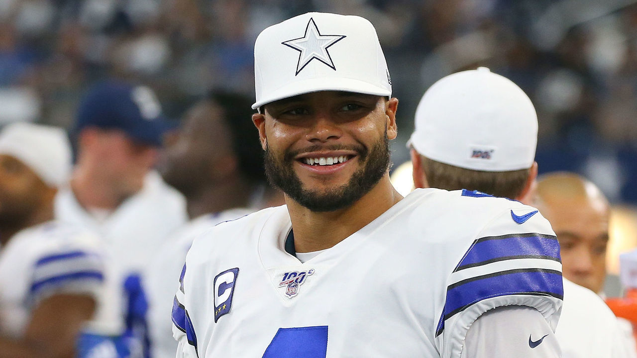 ARLINGTON, TEXAS - SEPTEMBER 08: Dak Prescott #4 of the Dallas Cowboys smiles on the sidelines in the fourth quarter against the New York Giants at AT&T Stadium on September 08, 2019 in Arlington, Texas.