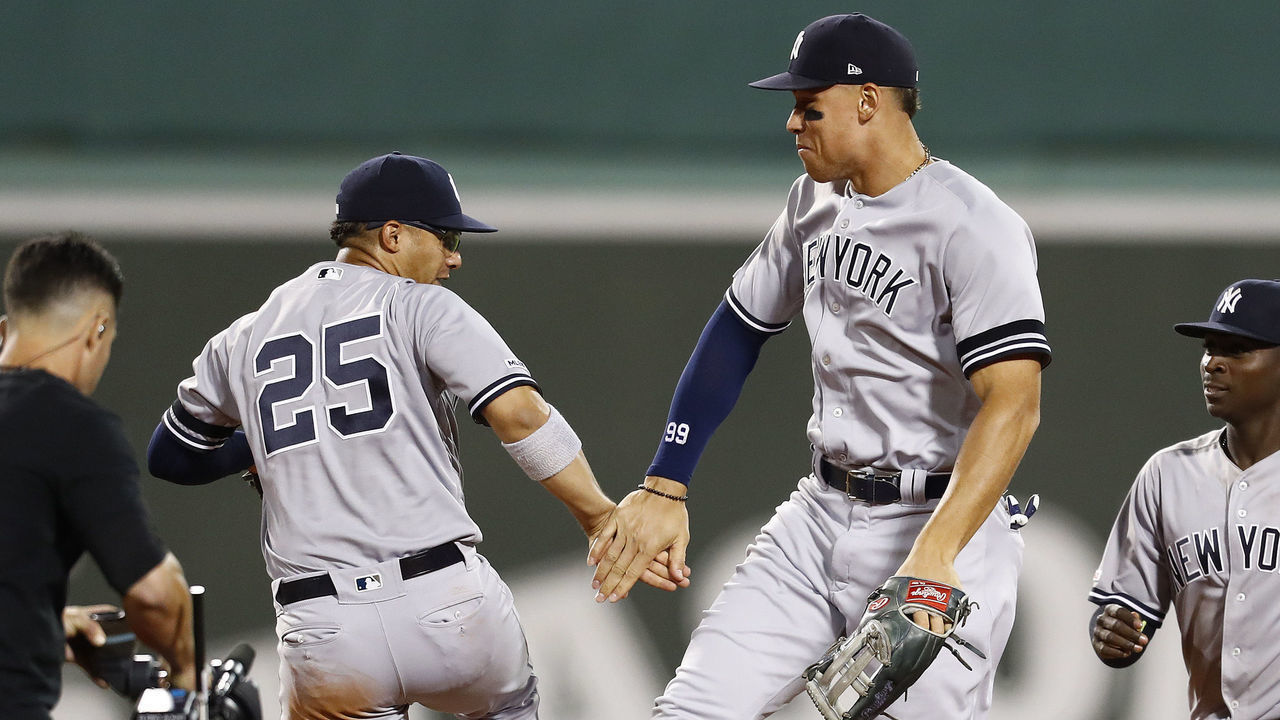 BOSTON, MASSACHUSETTS - SEPTEMBER 08: Aaron Judge #99 of the New York Yankees (R) and Gleyber Torres #25 of the New York Yankees (L) celebrate after the victory over the Boston Red Sox at Fenway Park on September 08, 2019 in Boston, Massachusetts.