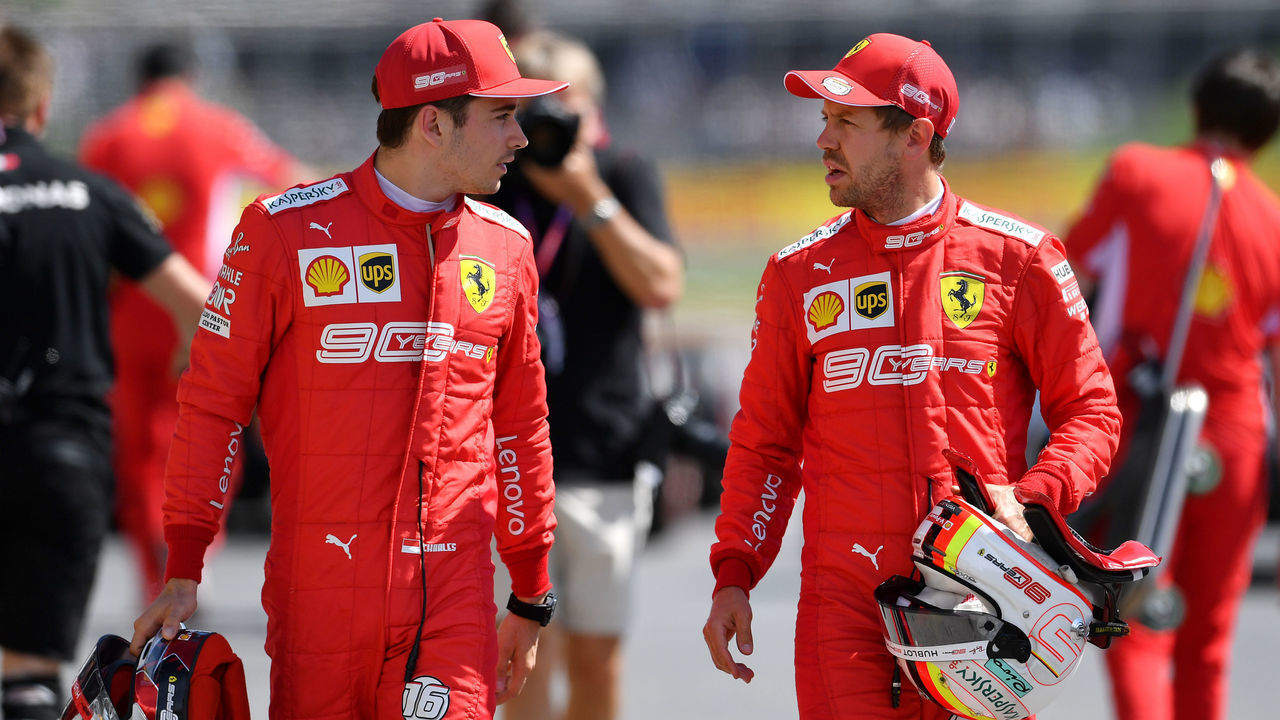 MONTREAL, QUEBEC - JUNE 08: Pole position qualifier Sebastian Vettel of Germany and Ferrari and third place qualifier Charles Leclerc of Monaco and Ferrari talk in parc ferme during qualifying for the F1 Grand Prix of Canada at Circuit Gilles Villeneuve on June 08, 2019 in Montreal, Canada.