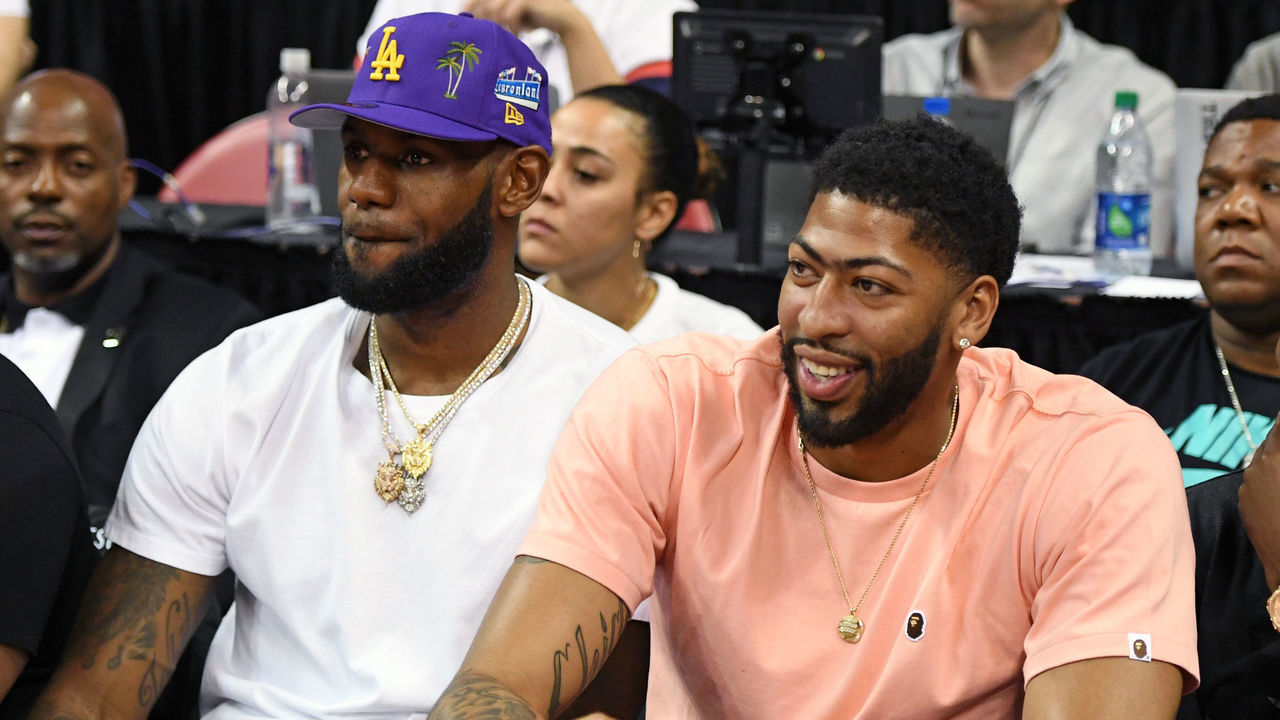 LAS VEGAS, NEVADA - JULY 05: NBA players LeBron James (L) and Anthony Davis watch a game between the New Orleans Pelicans and the New York Knicks during the 2019 NBA Summer League at the Thomas & Mack Center on July 5, 2019 in Las Vegas, Nevada.